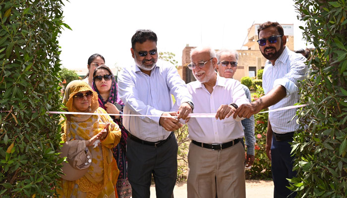 A former vice chancellor of the University of Karachi and renowned botanist, Professor Dr Muhammad Qaiser (centre right) and KU VC Prof Dr Khalid Mahmood Iraqi (centre left) cut ribbon to inaugurate the International Biodiversity Day 2025 on May 22, 2025. — Facebook@uoktimes
