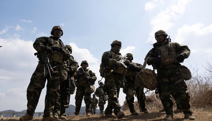 US soldiers from the 11th Engineer Battalion and 2nd Infantry Combined Division participate in the joint river-crossing exercise conducted for South Korean and US soldiers in Yeoncheon, Gyeonggi province, South Korea, 20 March 2024. —Reuters