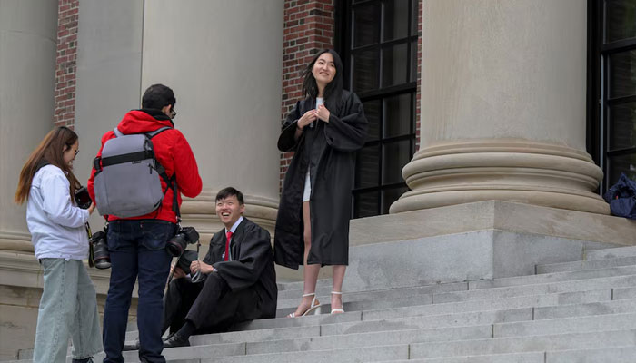 Harvard College graduates gather to take photos on the campus of Harvard University in Cambridge, Massachusetts, US, May 23, 2025. —Reuters