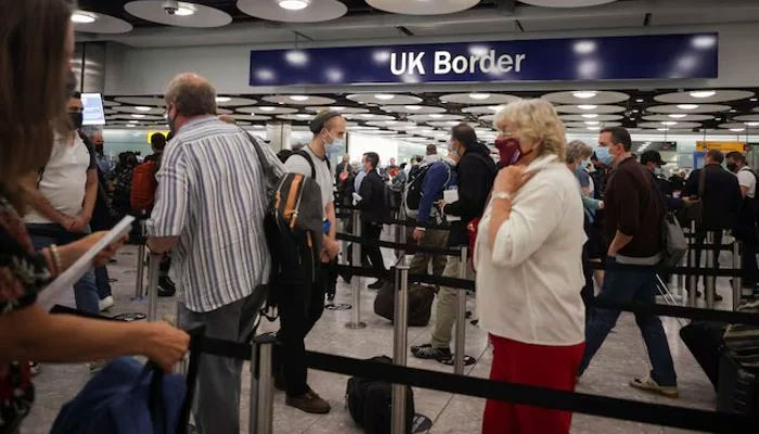 Arriving passengers queue at UK Border Control at Terminal 5 at Heathrow Airport in London, Britain June 29, 2021. — Reuters
