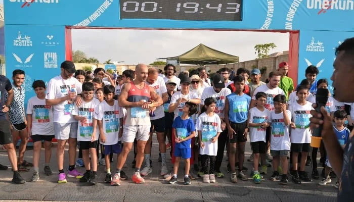 Participants of the half marathon can be seen getting ready at the starting point in DHA, Karachi, on May 24, 2025. — Reporter