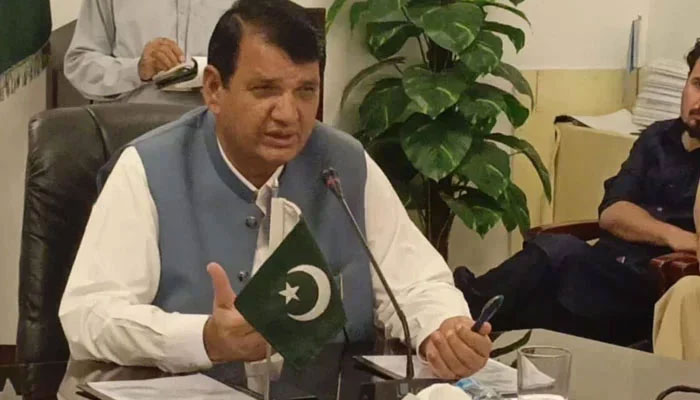 Federal Minister Amir Muqam speaks in a meeting. — APP/File