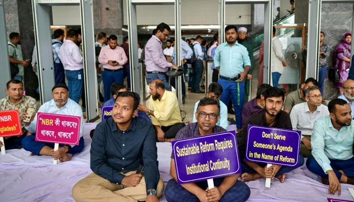 National Board of Revenue (NBR) employees protest in front of Bangladeshs NBR office in Dhaka . —AFP/File