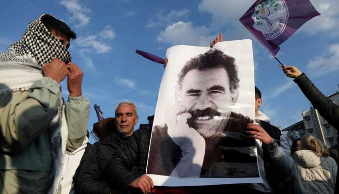 A demonstrator holds a picture of jailed Kurdish militant leader Abdullah Ocalan during a rally in Diyarbakir, Turkey, February 27, 2025. — Reuters