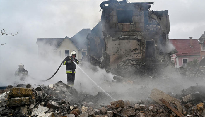 Firefighters extinguish a blaze following Russian strike in the Kyiv region. —AFP/File