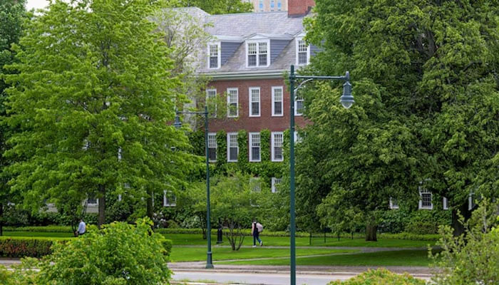 A student walks on the Allston campus of Harvard University, in Allston, Massachusetts, US, May 23, 2025 — Reuters