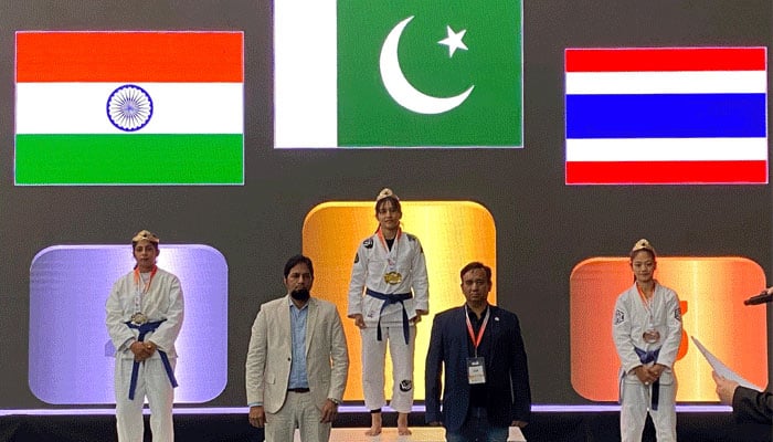 Pakistan’s Bano Kousar (center) stands on the podium after receiving the gold medal in Amman, Jordan, on May 25, 2025. — Reporter/Faizan Lakhani