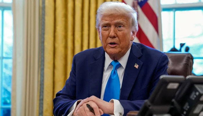 US President Donald Trump speaks as he signs documents in the Oval Office at the White House in Washington, US, February 4, 2025. — Reuters