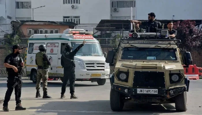 Indian security forces personnel escort an ambulance carrying the bodies of tourists who were killed in a suspected militant attack near Pahalgam, outside the police control room in Srinagar. — Reuters