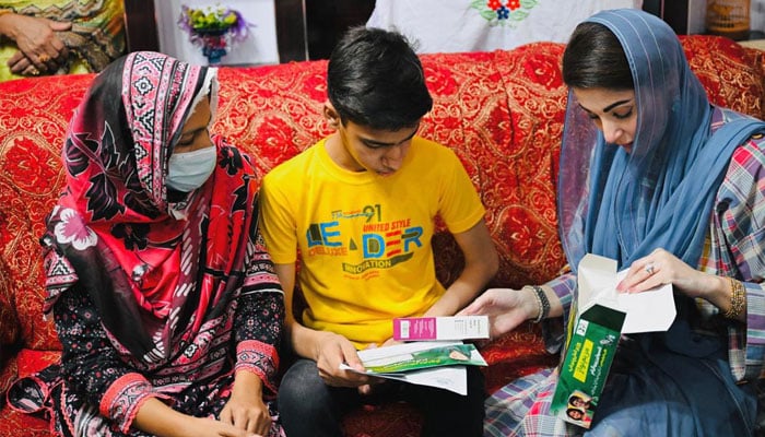 Punjab Chief Minister Maryam Nawaz giving diabetic kit to a child, May26, 2025. —Facebook@TheMaryamNSharif