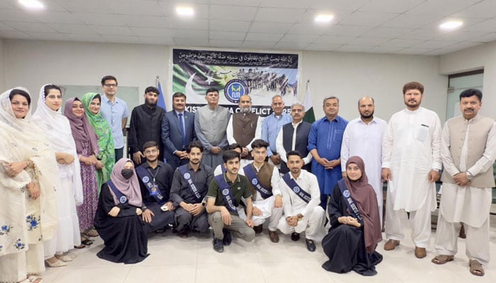 Participants pose for a group during the seminar, titled “Pakistan-India Conflict 2025: Lessons Learnt,” was organized by the NUML on May 27, 2025. — Facebook@Officialpeshawarcampus
