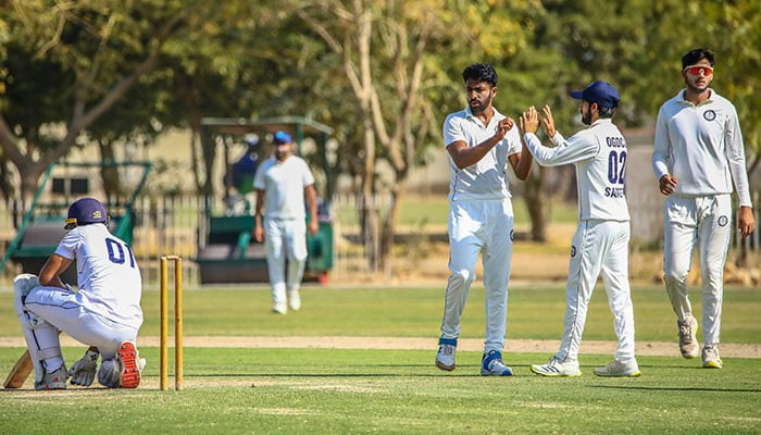 OGDCLs Mushtaq Ahmed (third from right) celebrates taking a wicket during the fourth day of the seventh round match of the Presidents Trophy Grade-I against KRL at the UBL Sports Complex in Karachi on February 15, 2025. — PCB