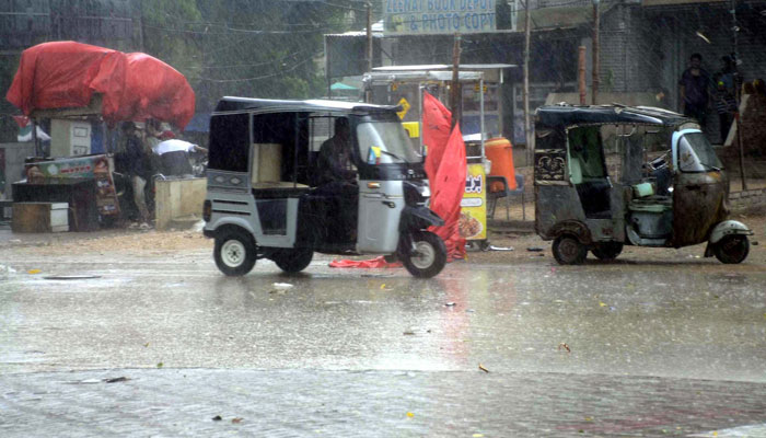Commuters are passing through a road during the downpour of summer season, in Hyderabad on May 28, 2025. — PPI