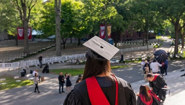 Graduating students, faculty, and family gather in Harvard Yard on May 28, 2025 in Cambridge, Massachusetts, the US. — AFP