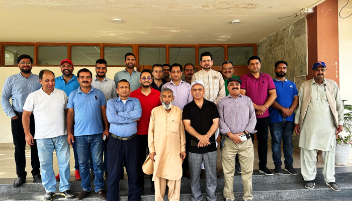 The newly-elected office-bearers of Rawalpindi Islamabad Sports Journalists Association (RISJA) pose for a group photo at Pakistan Sports Complex Islamabad. — The News