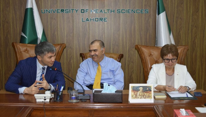 Ambassador of Kazakhstan to Pakistan, Mr Yerzhan Kistafin (left) speaks with UHS Vice Chancellor Prof Dr Ahsan Waheed Rathore (centre) during visit the University of Health Sciences (UHS) on May 29, 2025. — Facebook@uhs.lhrofficial