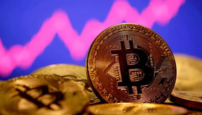 A representation of virtual currency Bitcoin is seen in front of a stock graph in this illustration taken January 8, 2021. — Reuters