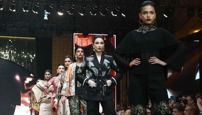 Pakistani models display creations by designers in Karachi, on October 23, 2024. — Online