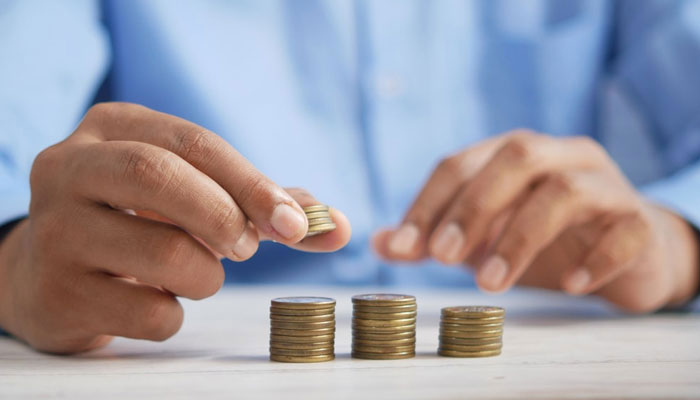 Representational image of a person sorting coins. — Unsplash/File