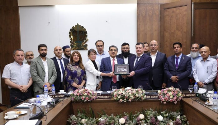 Uzbek delegation seen with Pakistani businessmen in this undated image.— APPFile