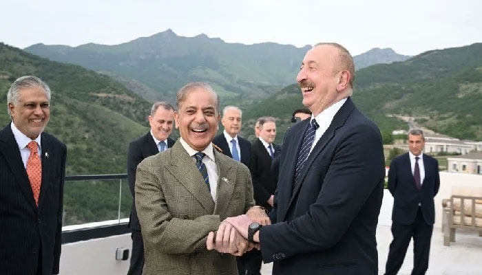 Prime Minister Shehbaz Sharif smiles, holds hands with Azerbaijani President Ilham Aliyev in Lachin on Tuesday.— APP