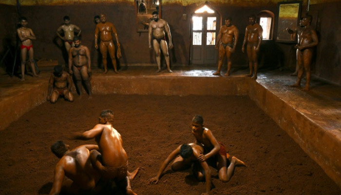 Wrestlers are seen amid practice. — AFP/File