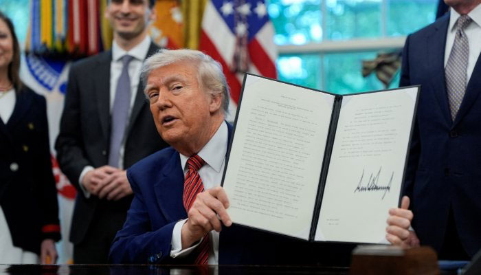 US President Donald Trump holds a signed executive order at the White House in Washington, DC, US, May 23, 2025. — Reuters