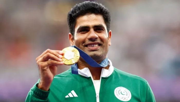Gold medallist Arshad Nadeem celebrates with his medal on the podium during the Paris 2024 Olympics Mens Javelin Throw victory ceremony at Stade de France, Saint-Denis, France on August 9, 2024. — Reuters