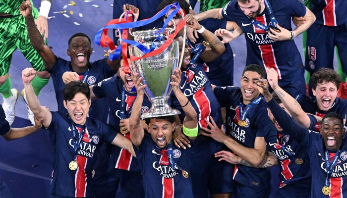 Paris Saint-Germain players holding trophy. —AFP/File