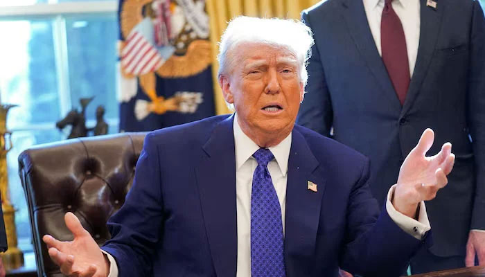 US President Donald Trump sits in the Oval Office of the White House, as he signs executive orders, in Washington, US, January 23, 2025. — Reuters