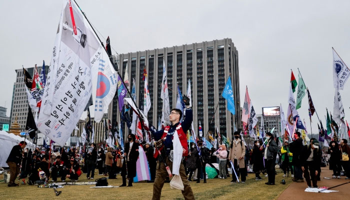 People attend a rally to celebrate the expulsion of South Korean President Yoon Suk Yeol in Seoul, South Korea, on April 5, 2025. — Reuters