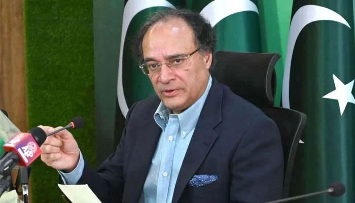 Federal Minister for Finance and Revenue, Senator Muhammad Aurangzeb addressing media persons at PTV Headquarters.— APP/File