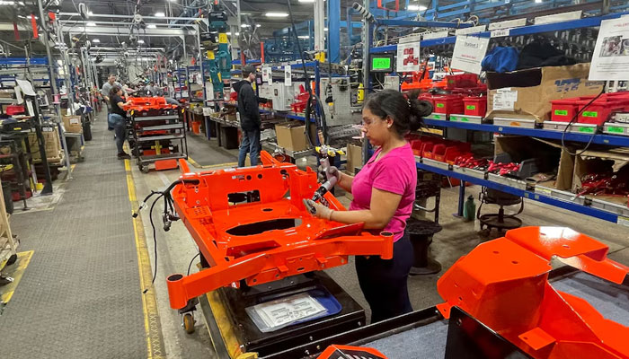 A worker installs parts at the start of an assembly line at an Ariens factory in Brillion, Wisconsin, US, March 5, 2025.—Reuters