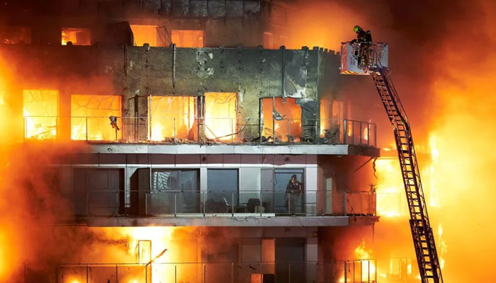 A large fire swept through two buildings in the Campanar neighborhood of Valencia. — AFP/File