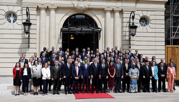 OECD Secretary-General Mathias Cormann and MCM members pose for a family photo after the opening ceremony of the 2025 Ministerial Council Meeting at the OECD Headquarters in Paris, France, June 3, 2025. —Reuters