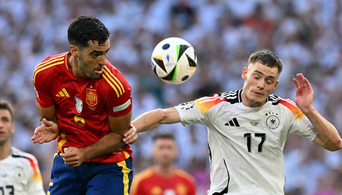 Spains midfielder Mikel Merino fights for the ball with Germanys midfielder Florian Wirtz at Euro 2024. —AFP/File