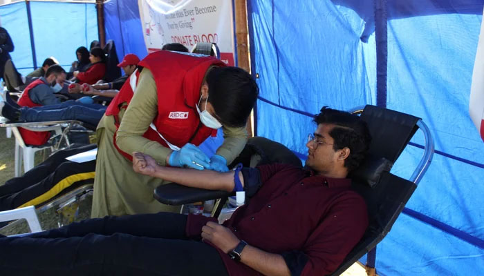 This image shows a healthcare person getting a blood donation on December 20, 2023. — Facebook/Pakistan Red Crescent