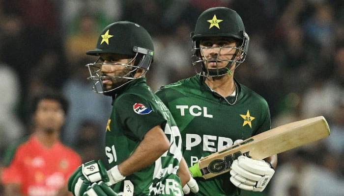 Saim Ayub (right) and teammate Mohammad Haris run between the wickets during the third and final Twenty20 international cricket match between Pakistan and Bangladesh at the Gaddafi Cricket Stadium in Lahore on June 1, 2025. — AFP