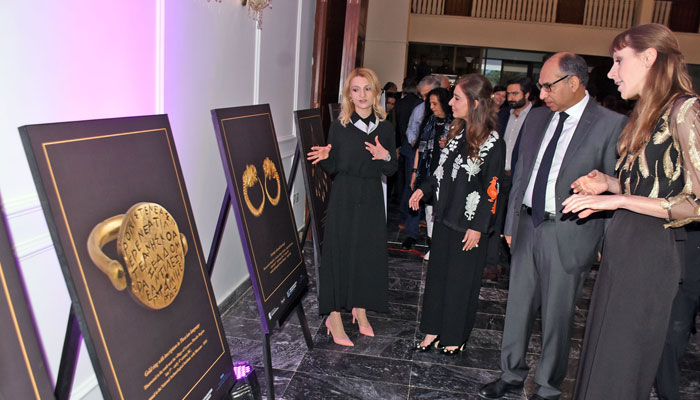 Ambassador of Bulgaria to Pakistan, Irena Gancheve, briefs the Chief Guest, Additional Secretary of the Ministry of Foreign Affairs Muhammad Ayub, and others during an exhibition at the Bulgarian Embassy in Islamabad on June 4, 2025. — Online