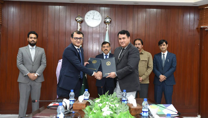 Officials shake hands after signing an MOU hosted by the NUML on June 3, 2025. — Facebook@NUMLOFFICIALPAGE