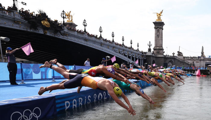 Athletes dive into the Seine during the Paris 2024 Olympic Games. — AFP/File