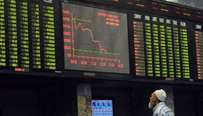 A trader observing the chart on electronic board at PSX. —Facebook@P.STOCKEXCHANGE/File