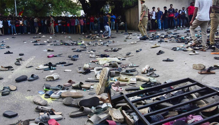 Abandoned shoes and a fallen barrier outside the Chinnaswamy Stadium in Bengaluru after a crush killed 11 people celebrating their teams IPL victory . —AFP