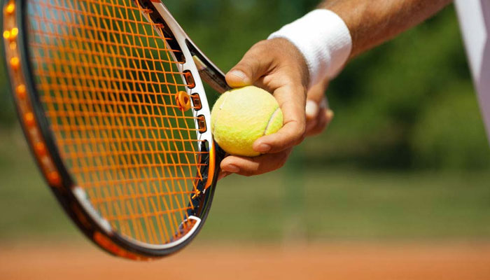 A representational image shows a tennis player holding a racket. — AFP/File