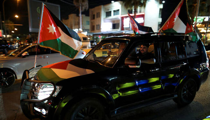 Jordanians celebrate after Jordan qualified for the World Cup for the first time, winning 3-0 over Oman, in Amman on June 5, 2025. — Reuters