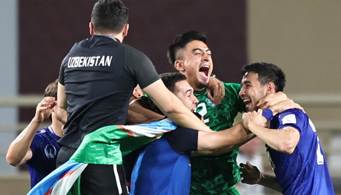 Uzbekistans players celebrate reaching the World Cup. — AFP/File