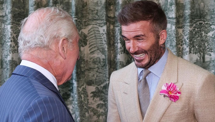 Britains King Charles III speaks with former England captain David Beckham at the Chelsea Flower Show in London in May 2025. — AFP/File