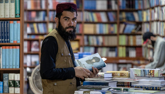 An Afghan person seen in a book store. — AFP/File