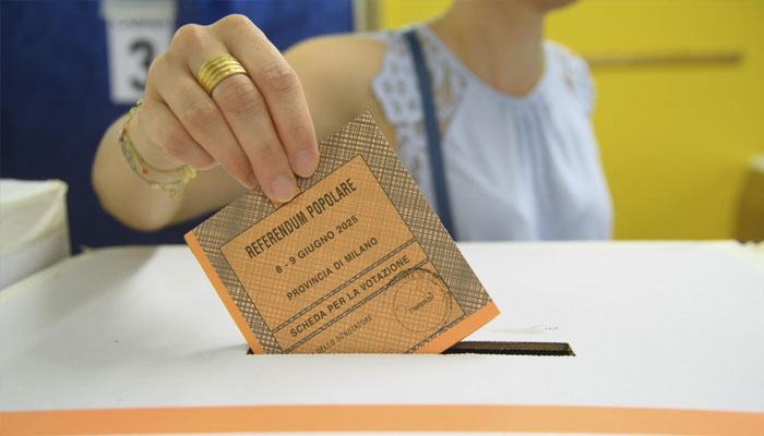 A voter casts a ballot in referendums on citizenship and job protections at a polling station in Milan, Italy, on June 8, 2025.—Reuters