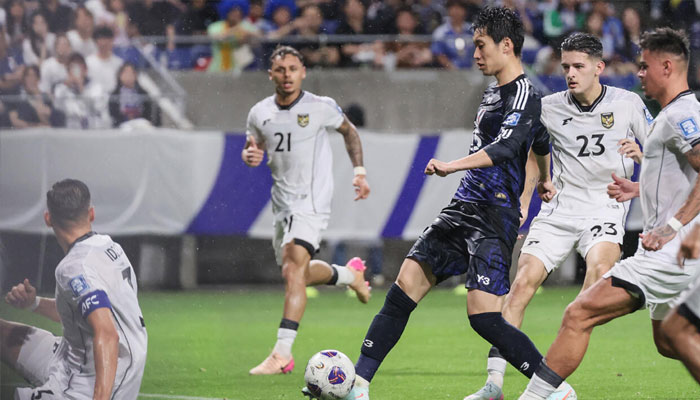Japans midfielder Daichi Kamada shoots against Indonesia in Osaka .—AFP/File